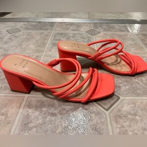 Beautiful orange open toe sandal with comfortable low heel.